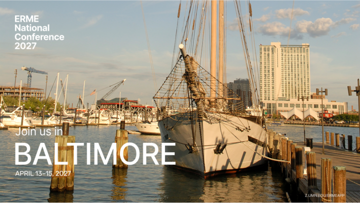Sailboat docked at a harbor with city buildings under a partly cloudy sky, during sunset.